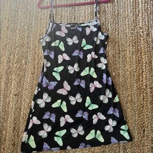 Purple mini dress with a butterfly design.
